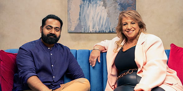 Dr Karan Rajan sitting with Emma Harris in the studio