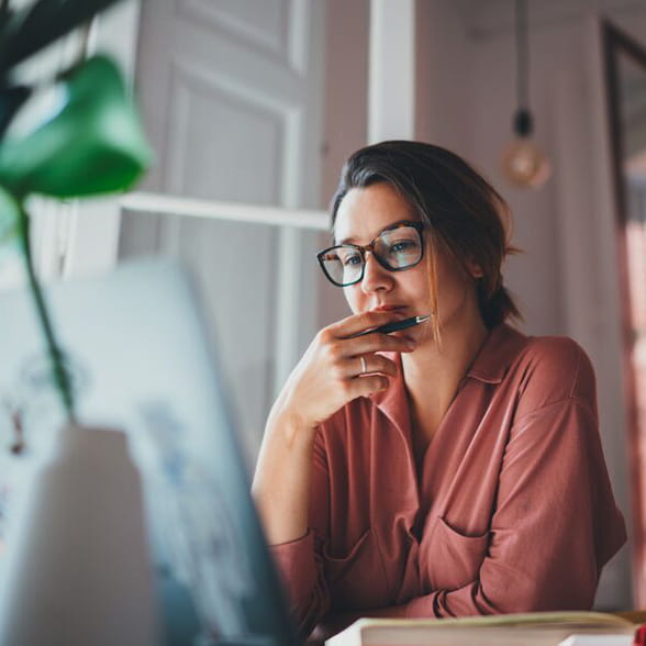 Person reviewing information on a laptop