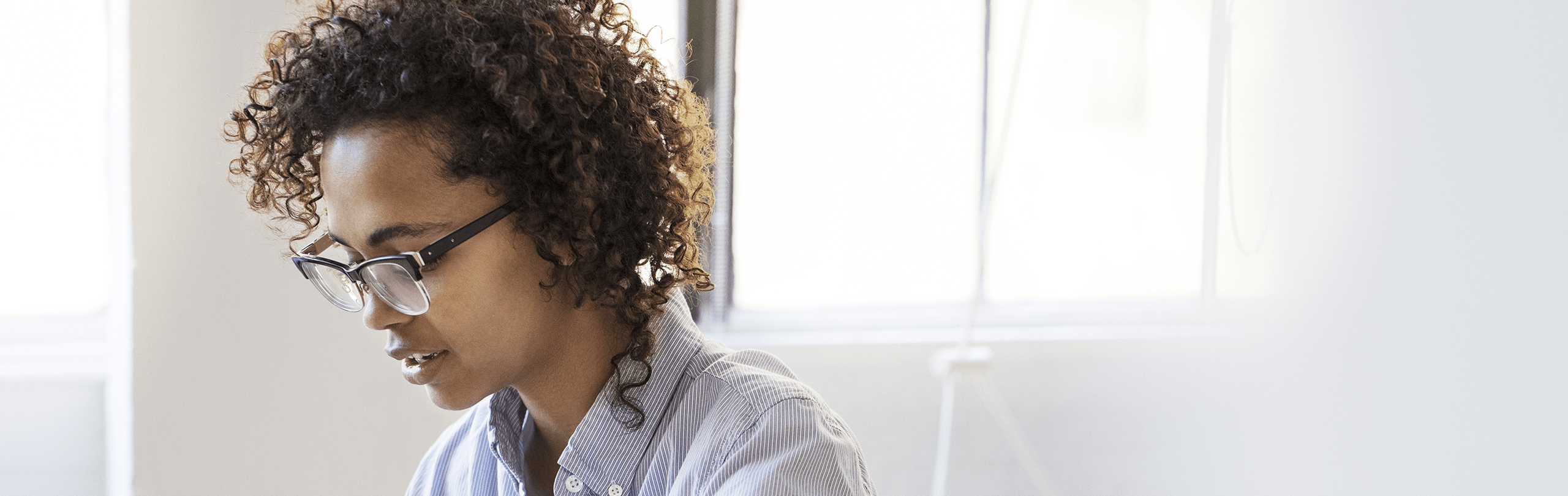 Woman sitting looking downwards