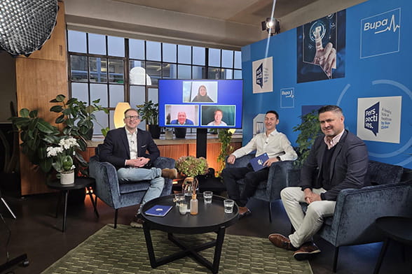 Host Carl Blake sits with Nick Brown and Dr Robin Clark on the set of Perspectives