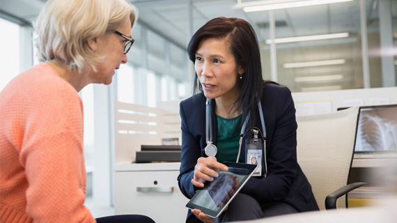 Doctor discussing x-ray images with a patient