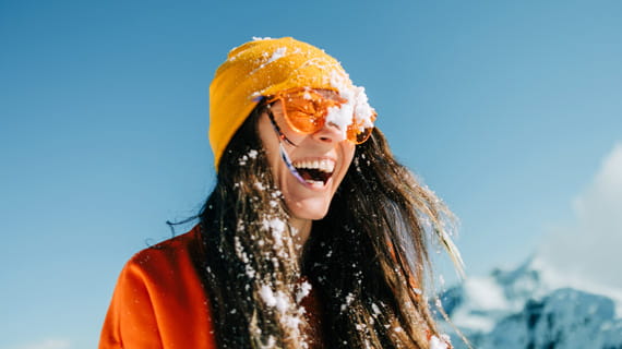 person laughing in the snow