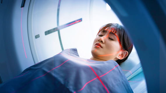 patient lying down to get a CT scan