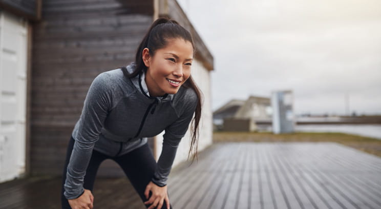 Woman outside resting after exercise