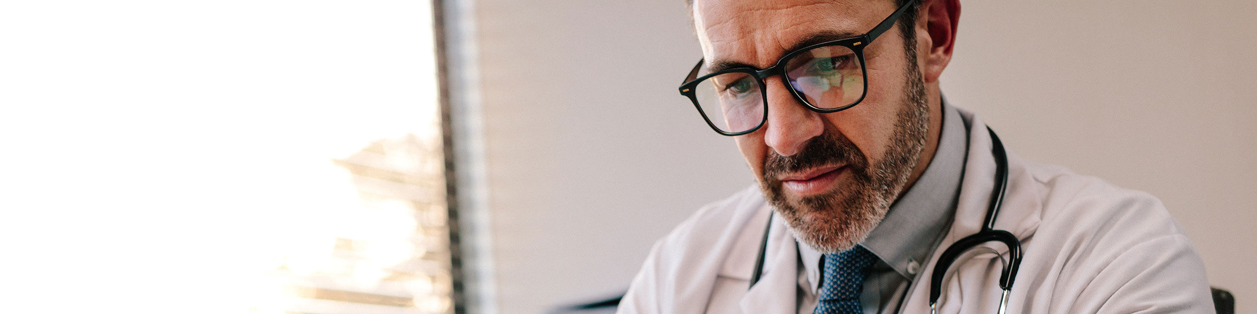 Doctor looking at a tablet device