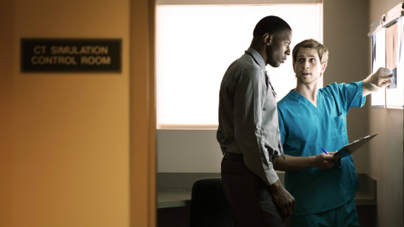 Doctors looking at x-ray board