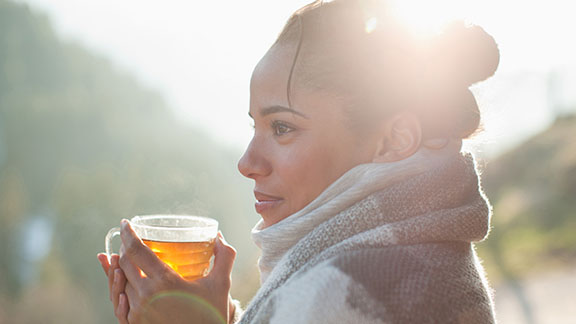 Woman having a hot drink