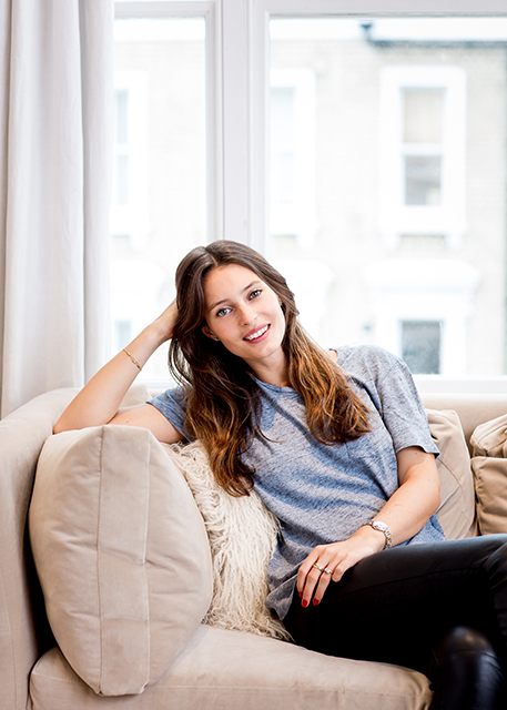 Deliciously Ella sitting on sofa
