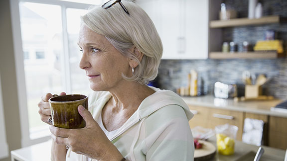 Older woman holding a cup