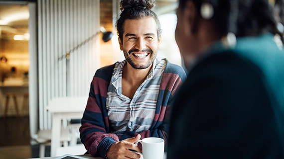 People drinking and socialising. Social contact is important for mental and physical wellbeing.